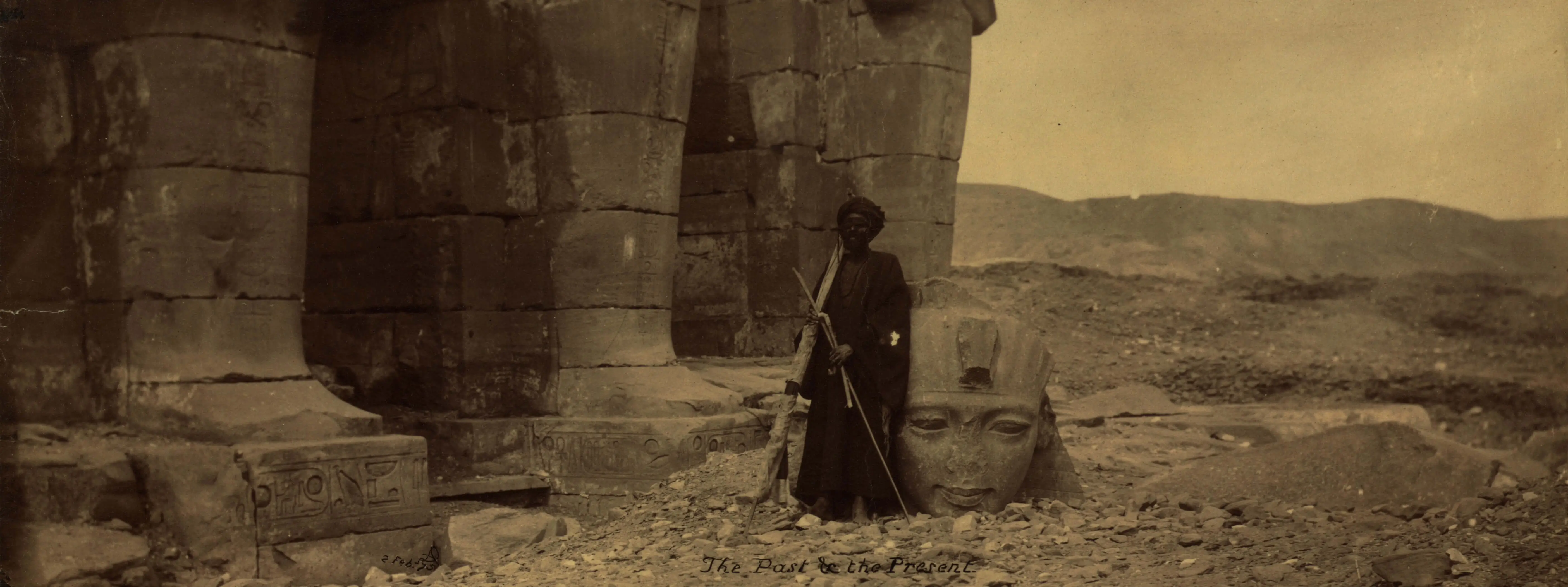 Blind man standing near the ruins of the Ramesseum, Egypt